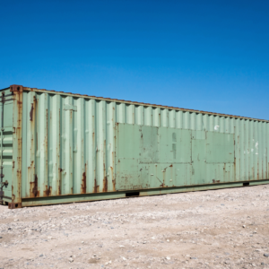 Used cargo worthy 40ft shipping container with faded paint and rust streaks along its 12 metre length