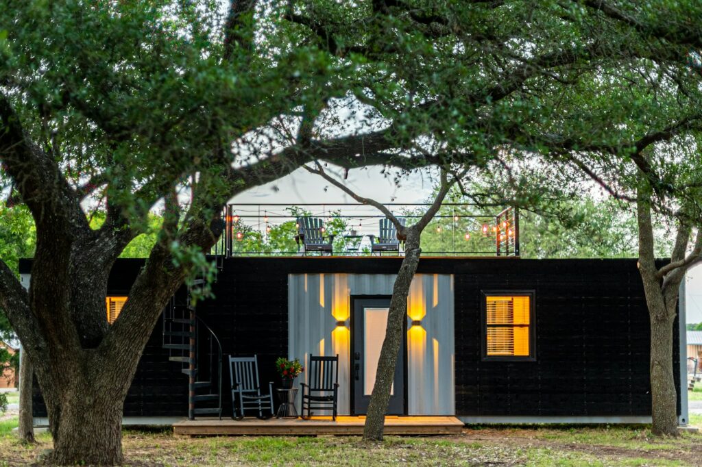 Modern shipping container home conversion with timber deck