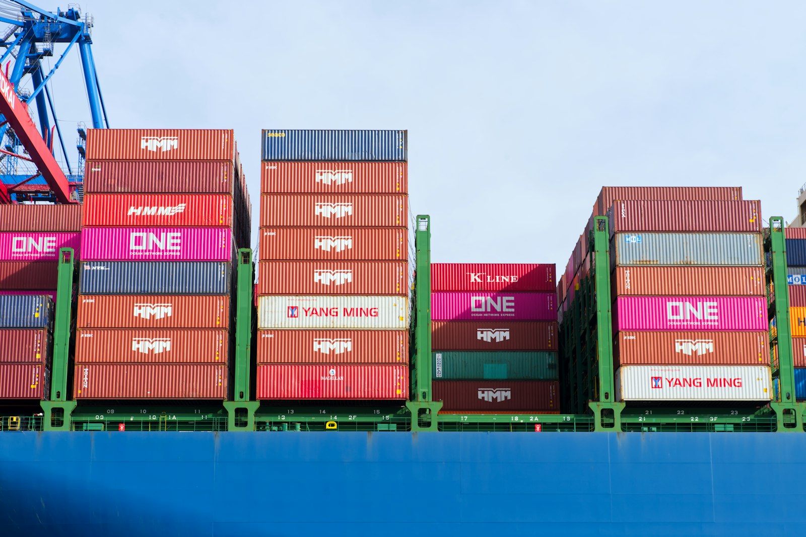 Colourful stacked shipping containers on a freighter